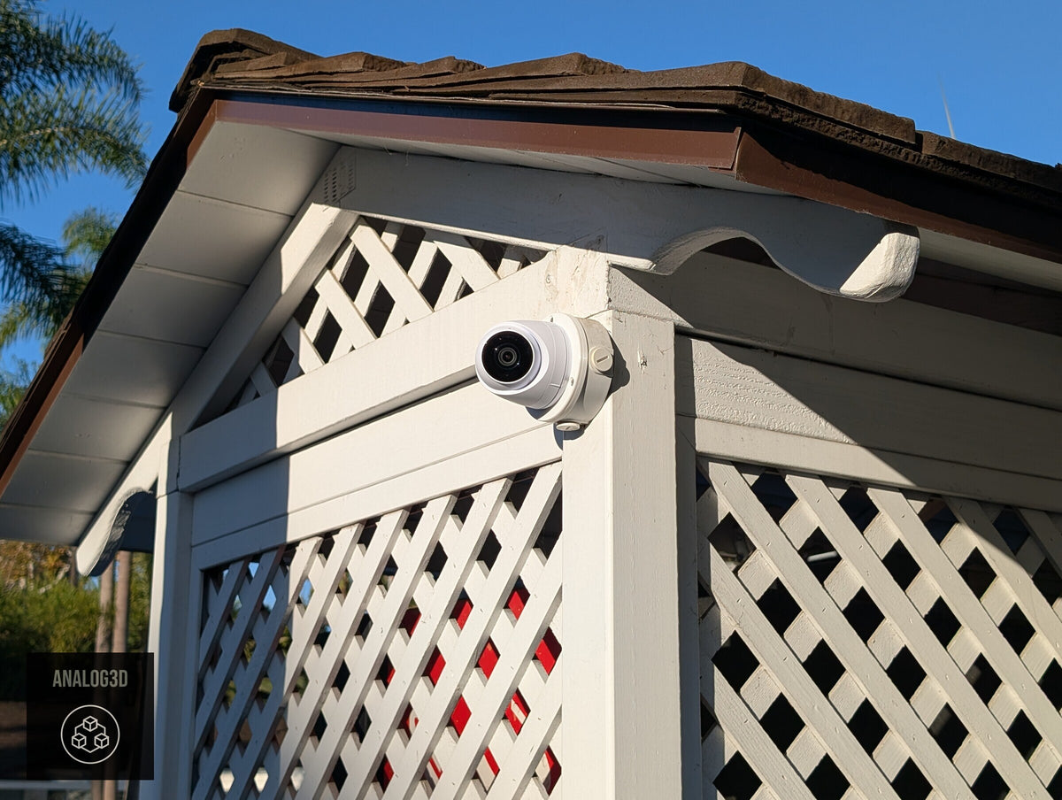 Ubiquiti UVC-G5-Turret-Ultra installed on a Dahua PFA136 box under the roofline (customer install photo)