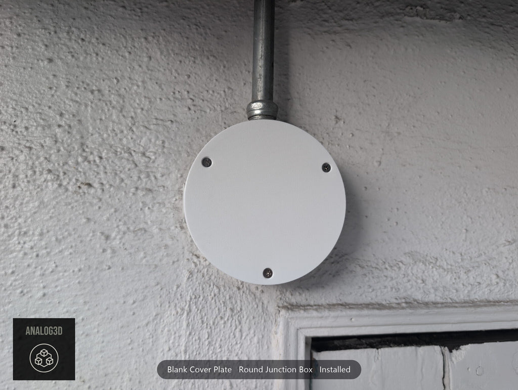 Blank cover plate installed on a round junction box, straight on (customer install photo)