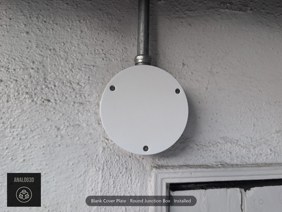 Blank cover plate installed on a round junction box, straight on (customer install photo)
