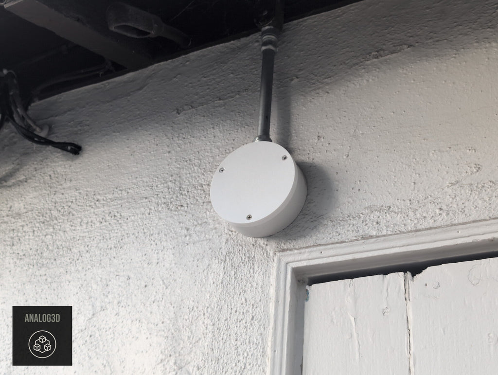 Blank cover plate installed on a Dahua PFA137 junction box under the eave (customer install photo)