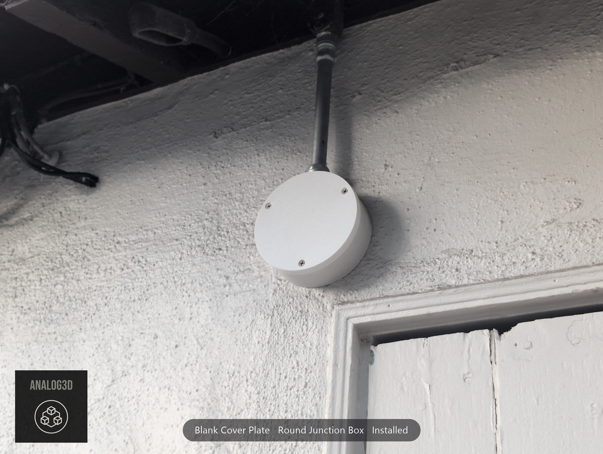 Blank cover plate installed on a round junction box under the eave (customer install photo)