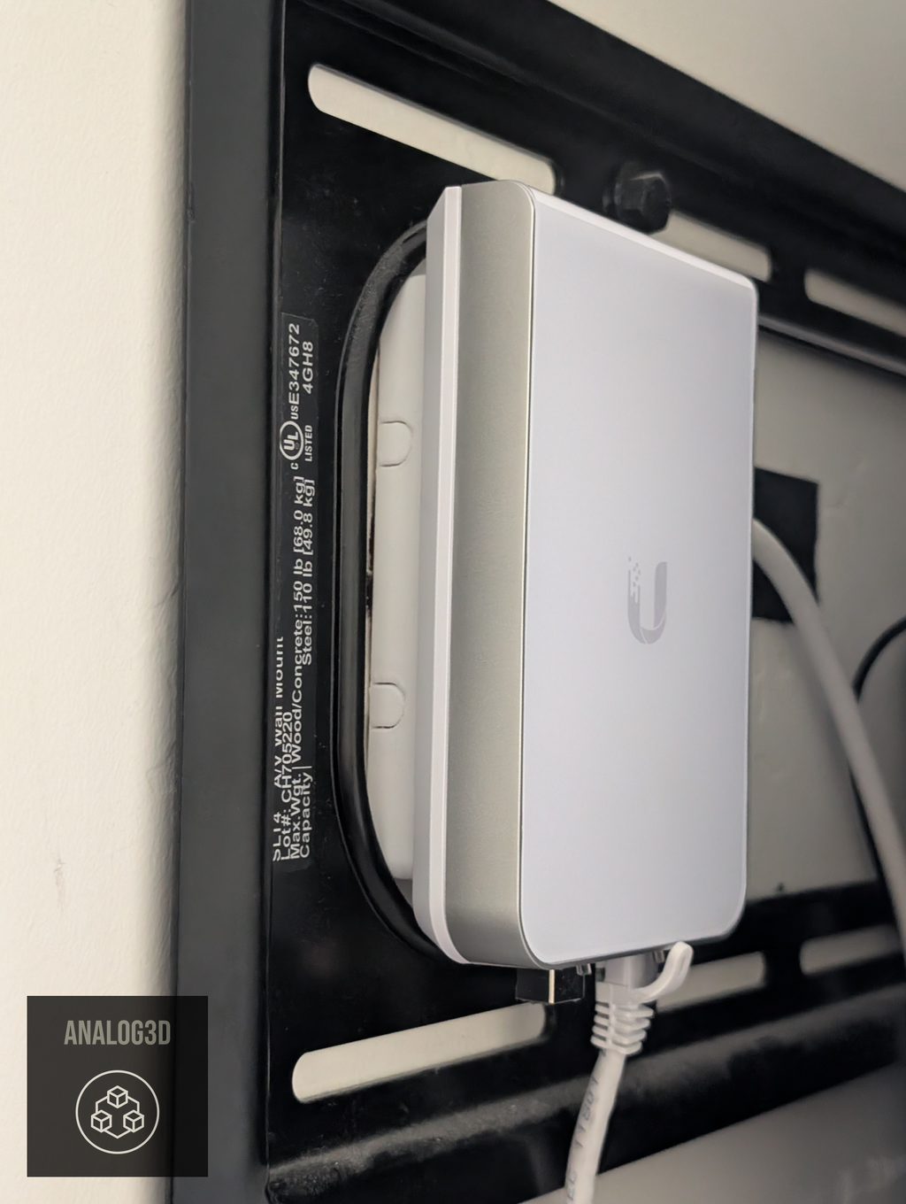 Box spacer installed behind a UniFi in-wall access point (single-gang shown)