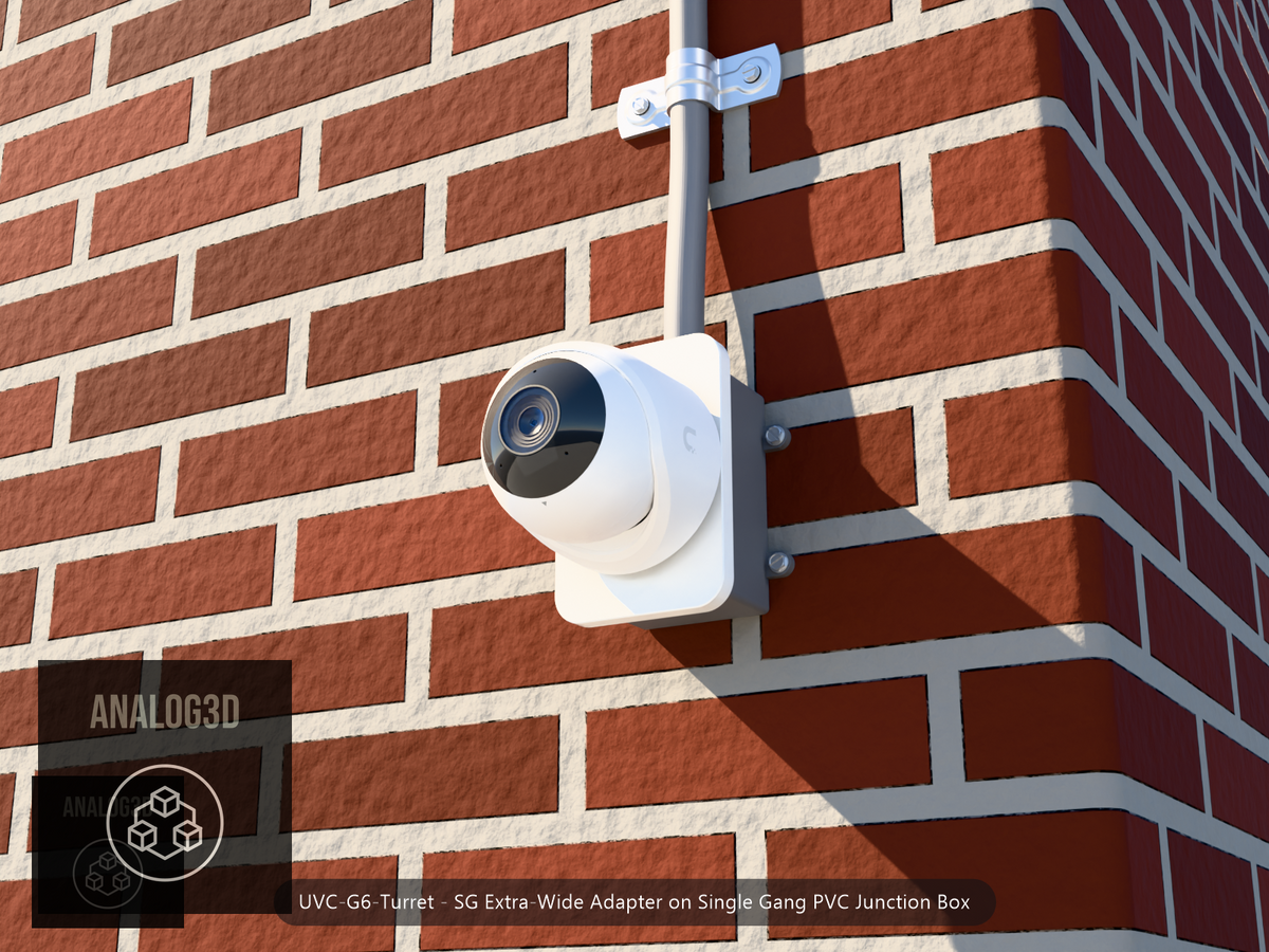 UVC-G6-Turret SG Extra-Wide adapter plate bolted to a single gang PVC junction box with 1/2 inch PVC conduit, brick wall