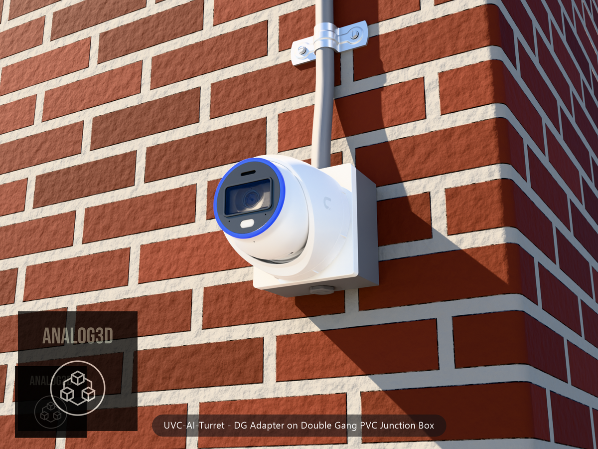 UVC-AI-Turret DG adapter plate bolted to a double gang PVC junction box, 1/2 inch PVC conduit from the top hub, threaded plug in the bottom hub, brick wall