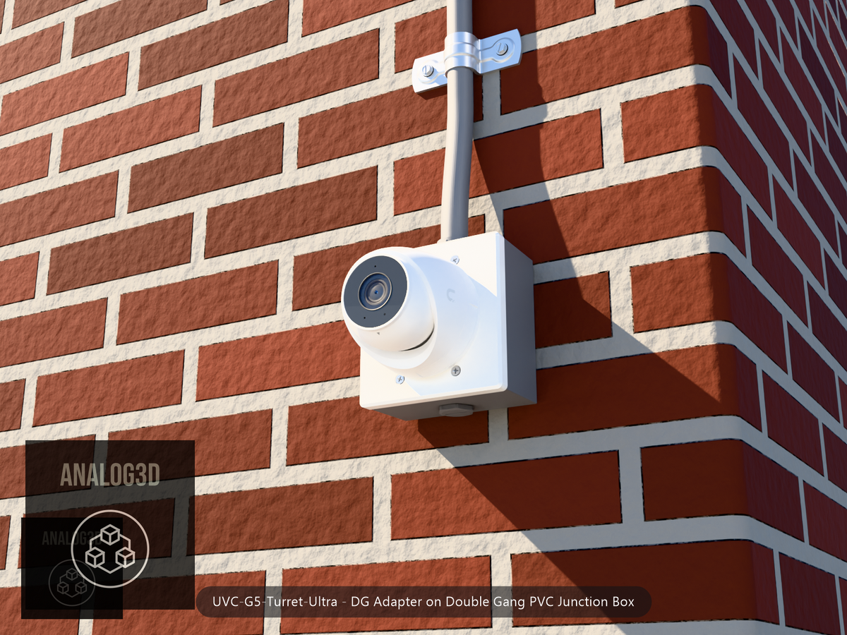 UVC-G5-Turret-Ultra DG adapter plate bolted to a double gang PVC junction box, 1/2 inch PVC conduit from the top hub, threaded plug in the bottom hub, brick wall