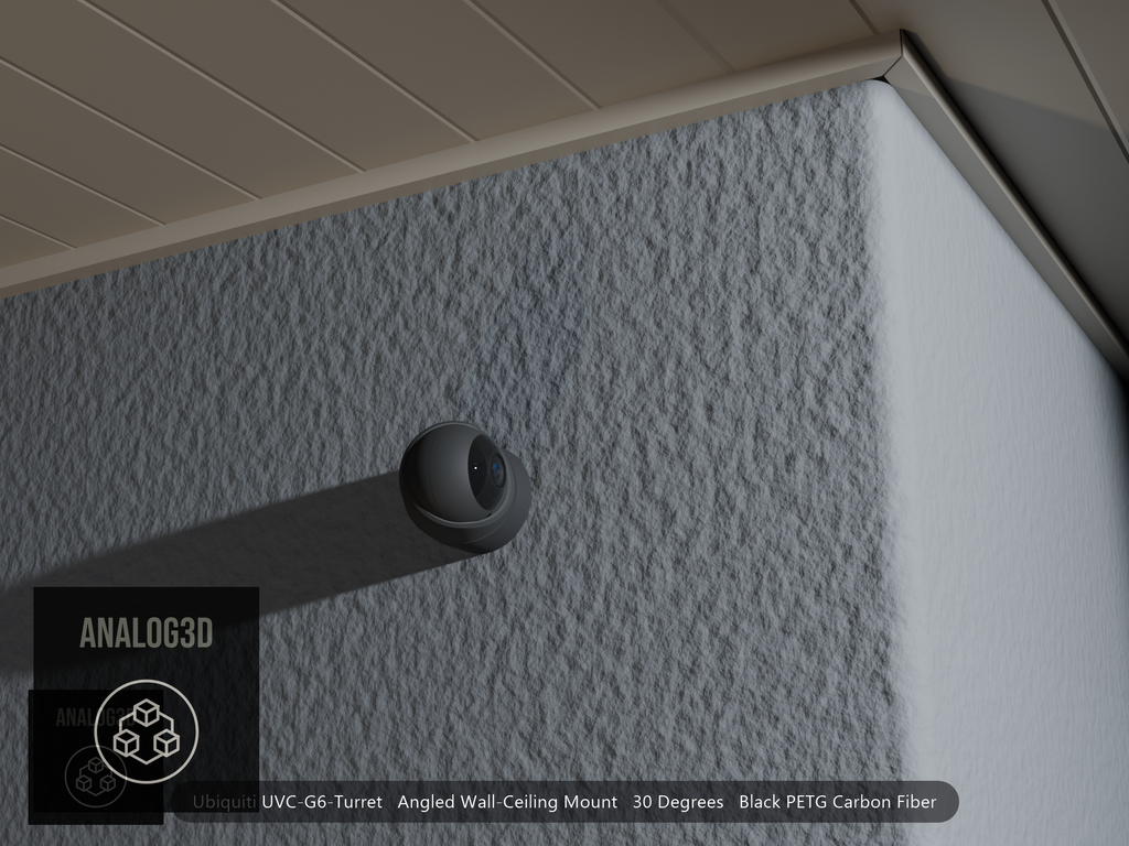 Ubiquiti UVC-G6-Turret angled wall mount in black PETG carbon fiber on a stucco wall at night