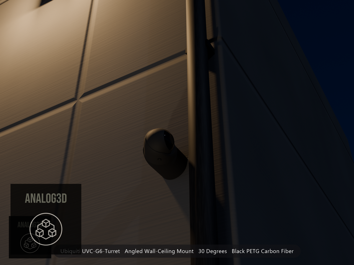Ubiquiti UVC-G6-Turret on black PETG carbon fiber angled wall mount extending past a downspout on a concrete wall at night