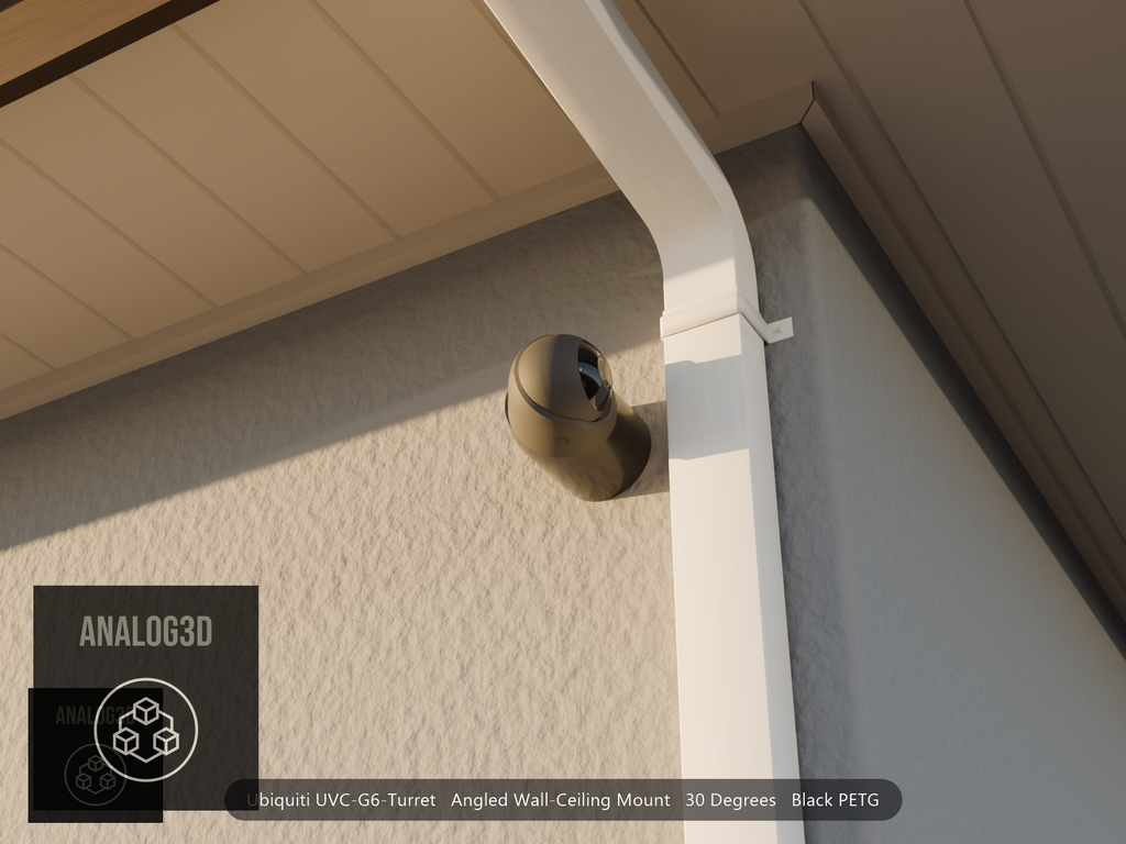 Ubiquiti UVC-G6-Turret on black PETG angled wall mount extending past a downspout on a stucco wall at golden hour