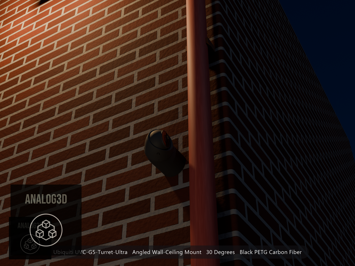Ubiquiti UVC-G5-Turret-Ultra on black PETG carbon fiber angled wall mount extending past a downspout on a brick wall at night