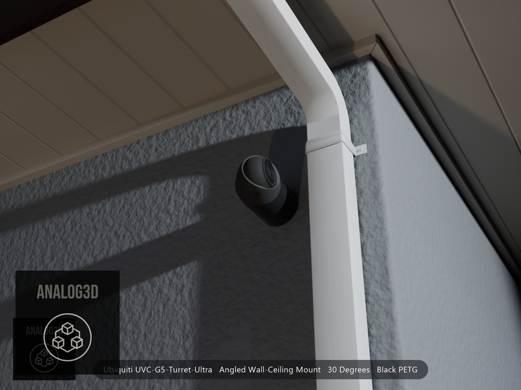 Ubiquiti UVC-G5-Turret-Ultra on black PETG angled wall mount extending past a downspout on a stucco wall at night