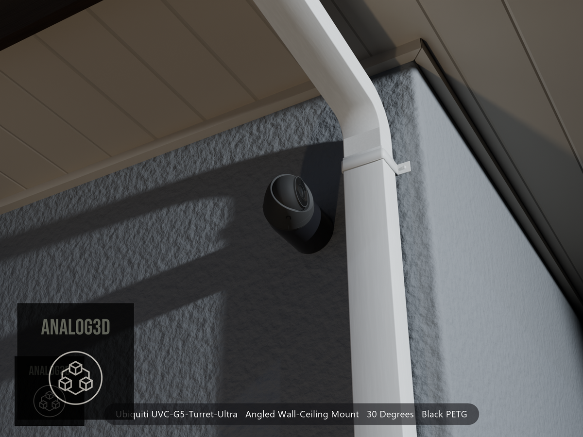 Ubiquiti UVC-G5-Turret-Ultra on black PETG angled wall mount extending past a downspout on a stucco wall at night
