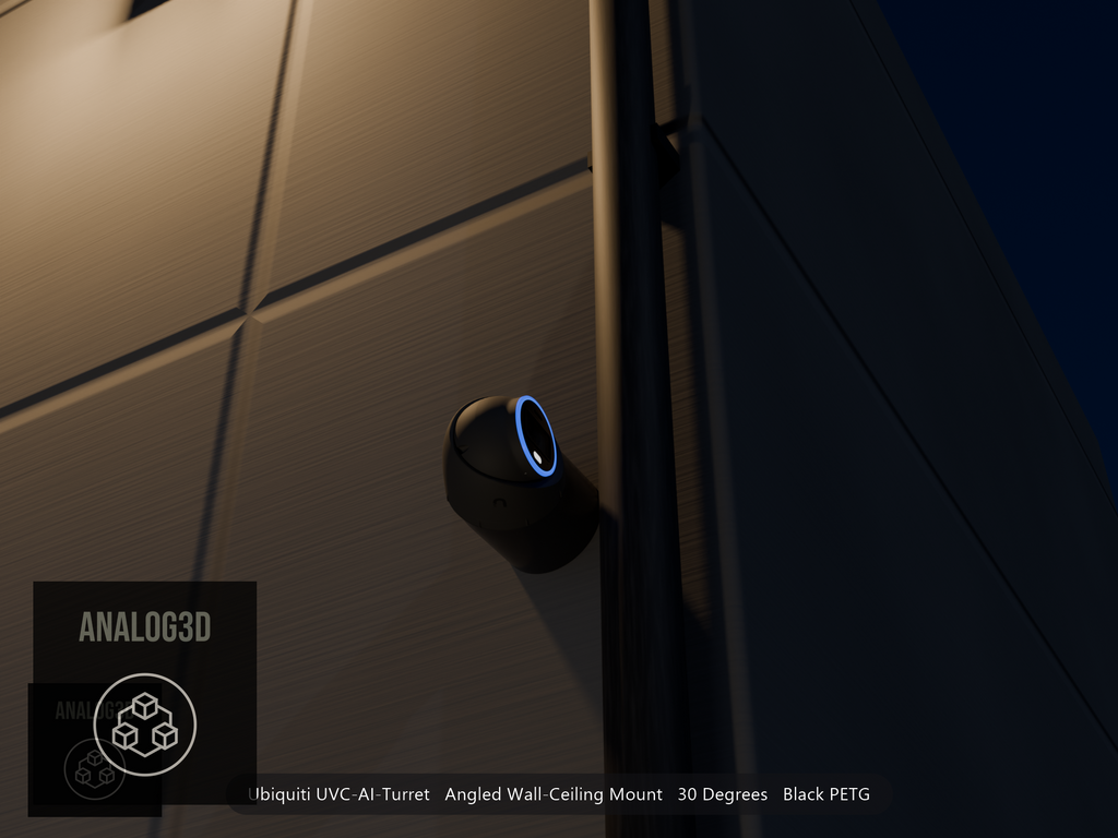 Ubiquiti UVC-AI-Turret on black PETG angled wall mount extending past a downspout on a concrete wall at night