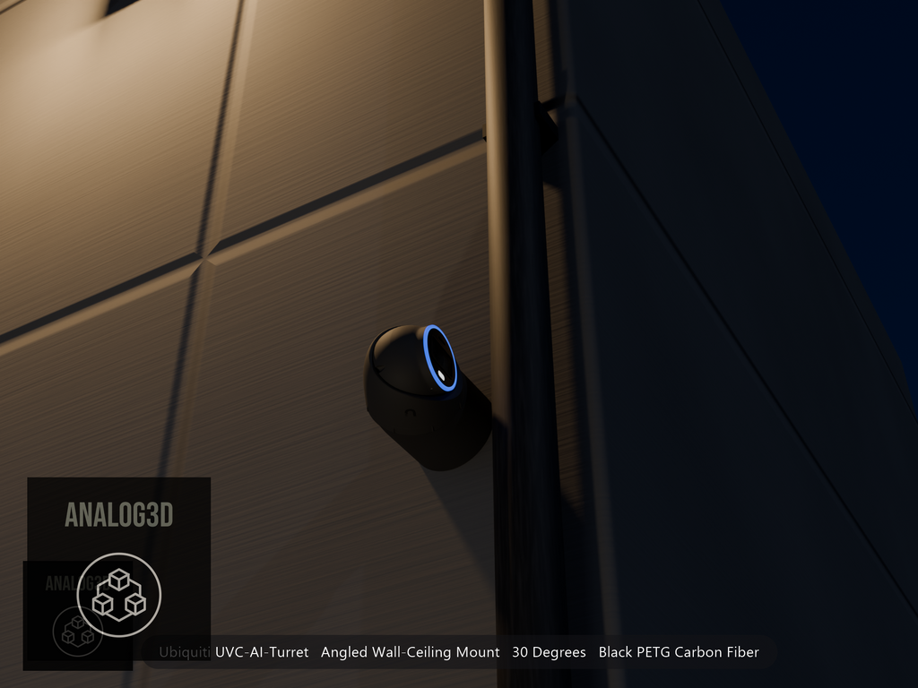 Ubiquiti UVC-AI-Turret on black PETG carbon fiber angled wall mount extending past a downspout on a concrete wall at night