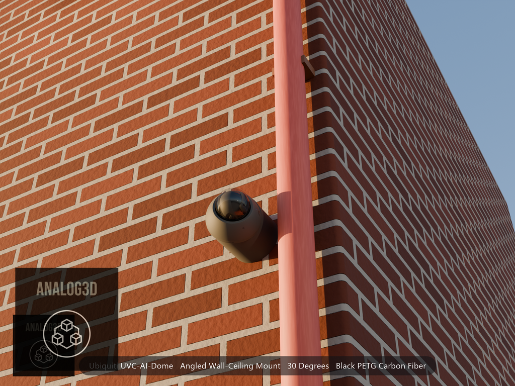 Ubiquiti UVC-AI-Dome on black PETG carbon fiber angled wall mount extending past a downspout on a brick wall at golden hour
