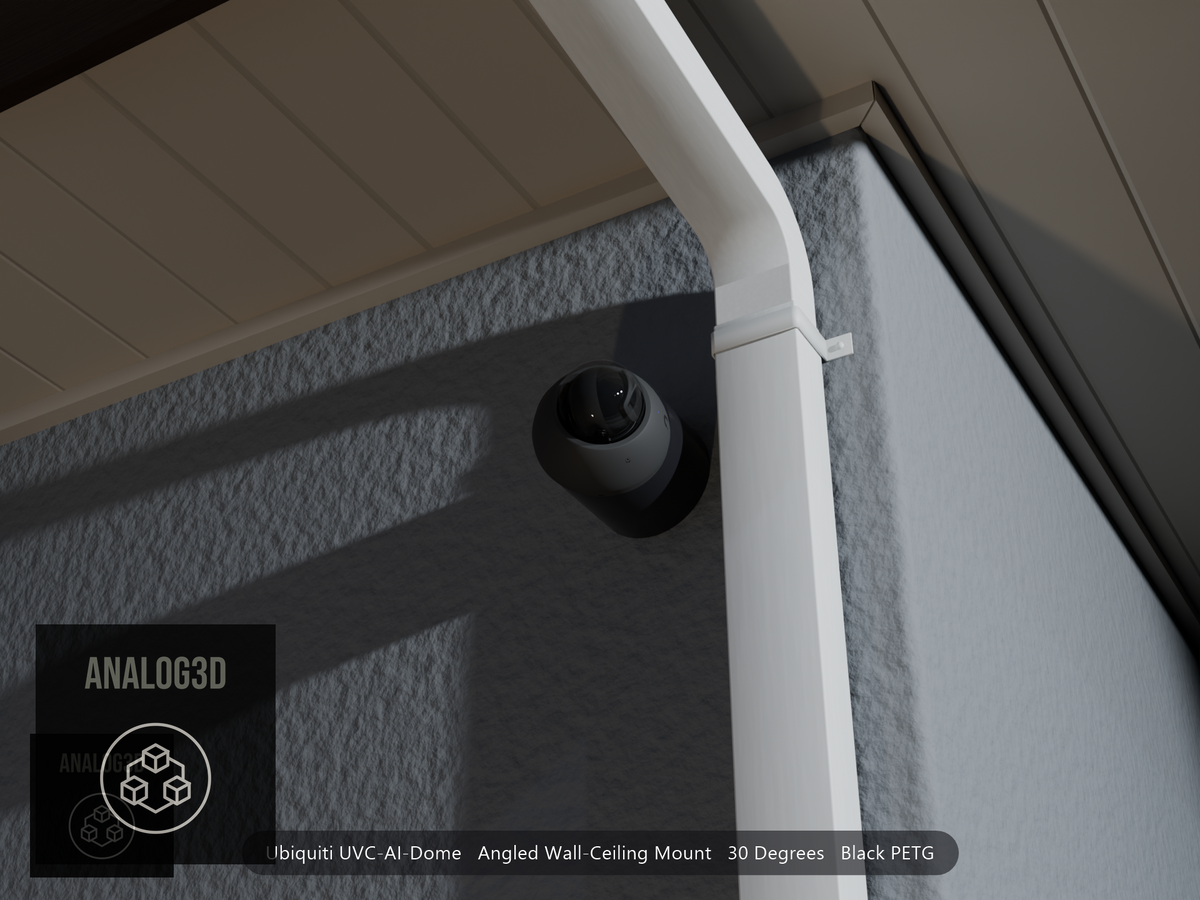 Ubiquiti UVC-AI-Dome on black PETG angled wall mount extending past a downspout on a stucco wall at night