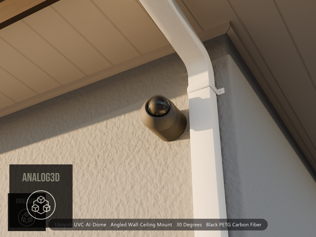 Ubiquiti UVC-AI-Dome on black PETG carbon fiber angled wall mount extending past a downspout on a stucco wall at golden hour