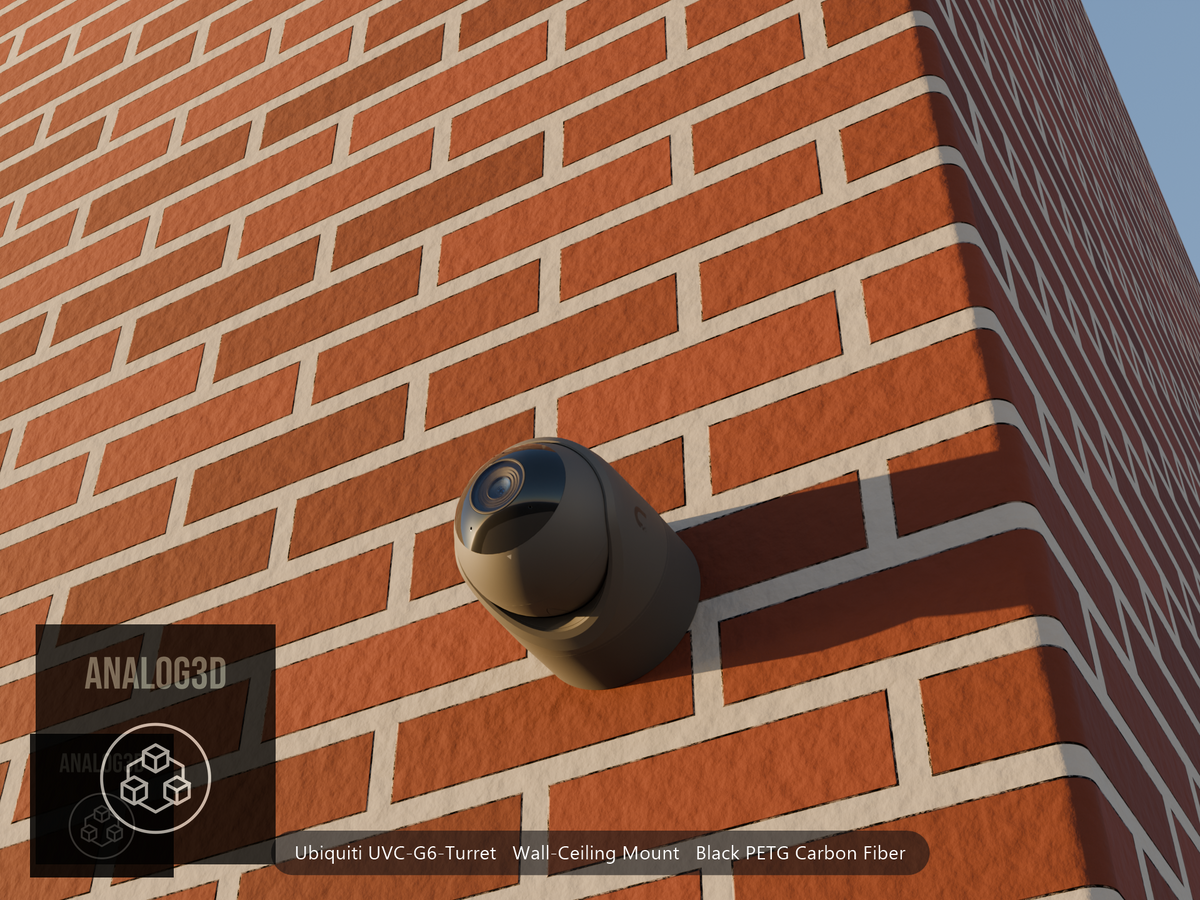 Ubiquiti UVC-G6-Turret on black PETG carbon fiber wall-ceiling mount on a brick wall at golden hour
