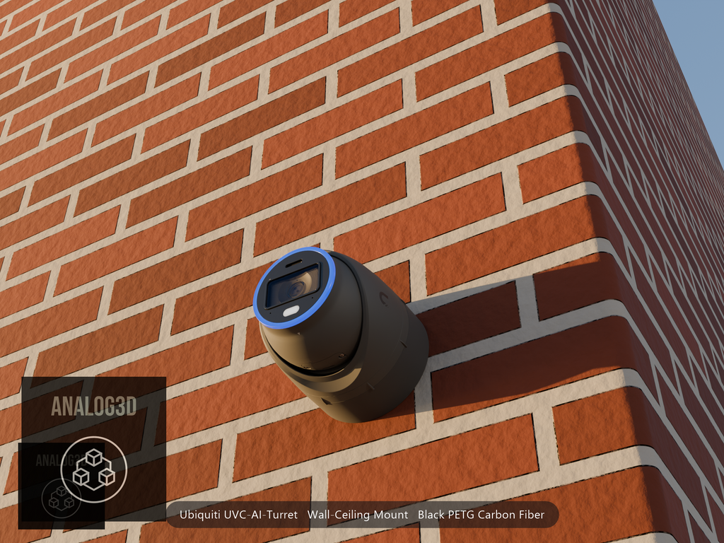 Ubiquiti UVC-AI-Turret on black PETG carbon fiber wall-ceiling mount on a brick wall at golden hour