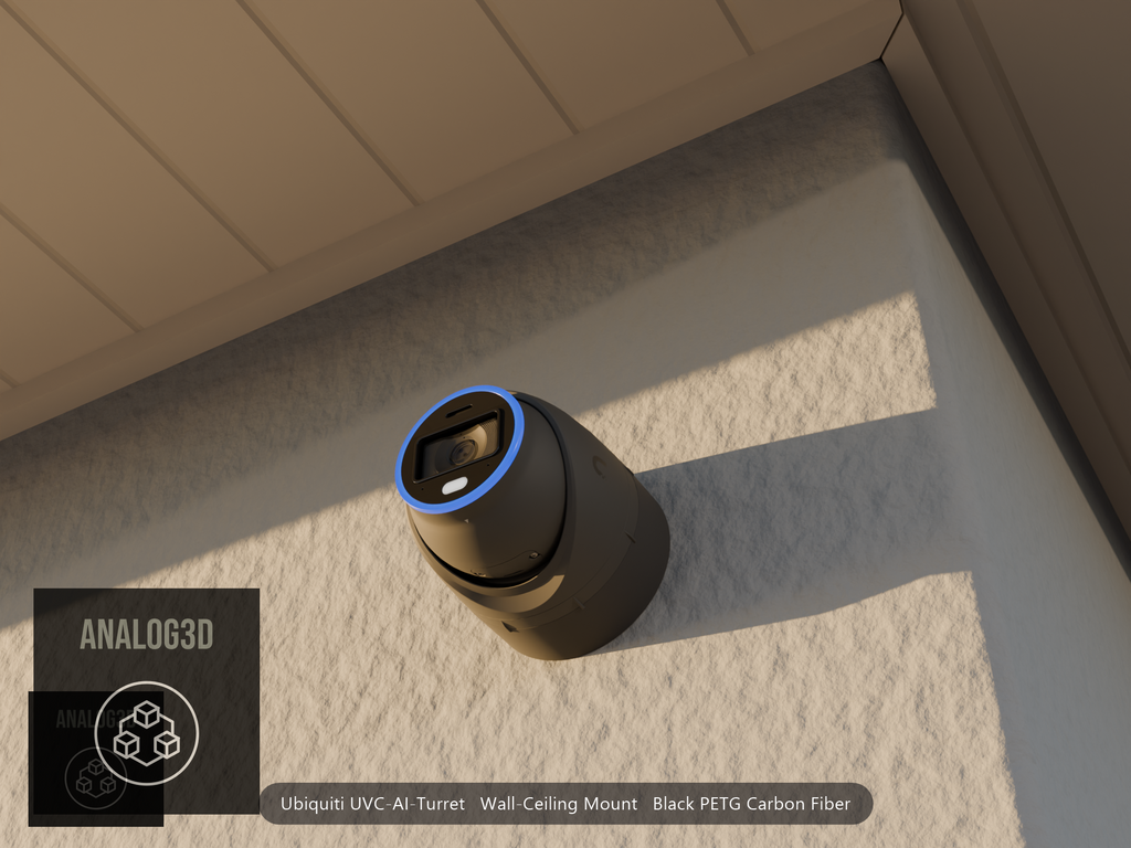 Ubiquiti UVC-AI-Turret on black PETG carbon fiber wall-ceiling mount on a stucco wall at golden hour