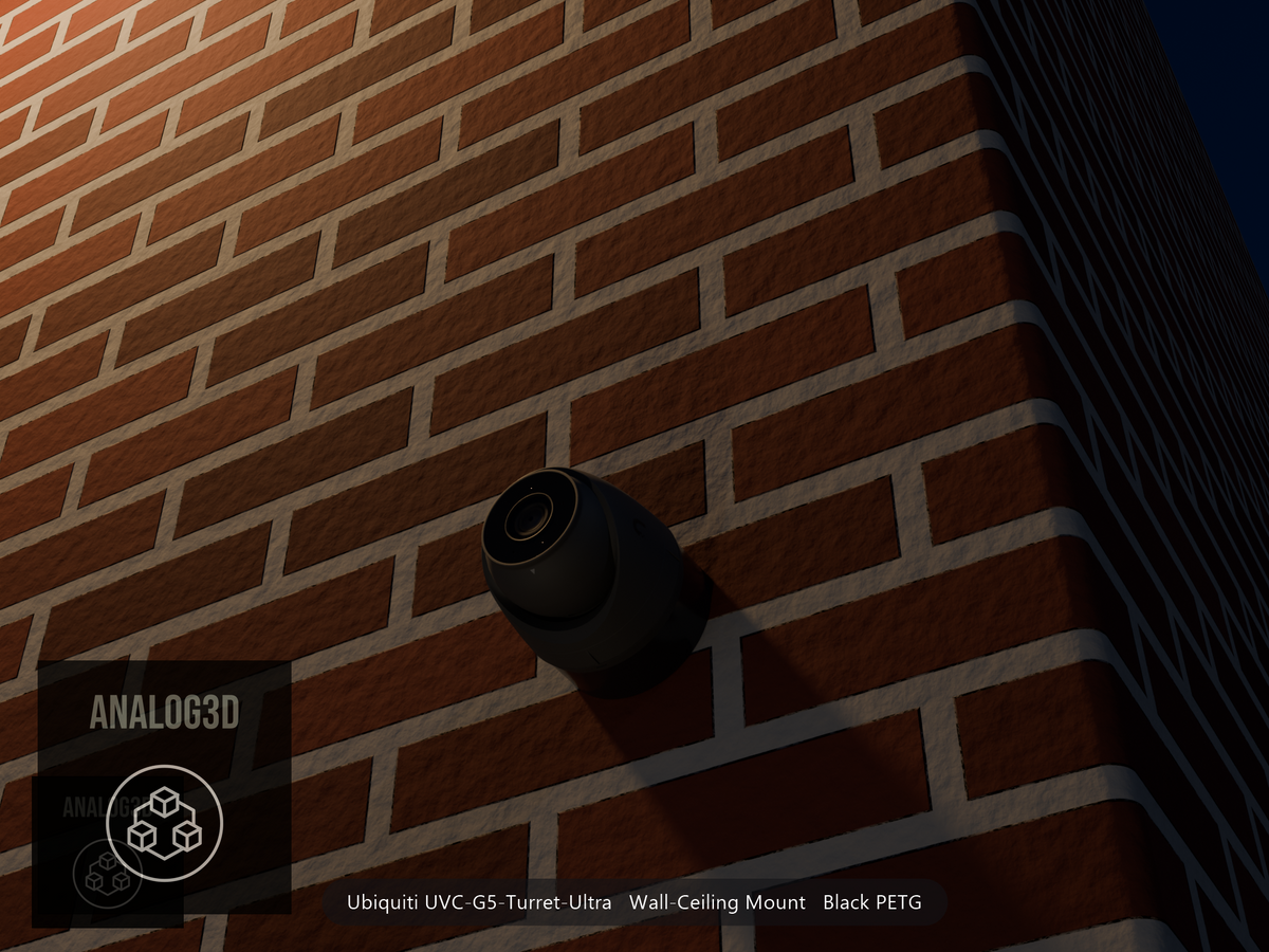 Ubiquiti UVC-G5-Turret-Ultra on black PETG wall-ceiling mount on a brick wall at night