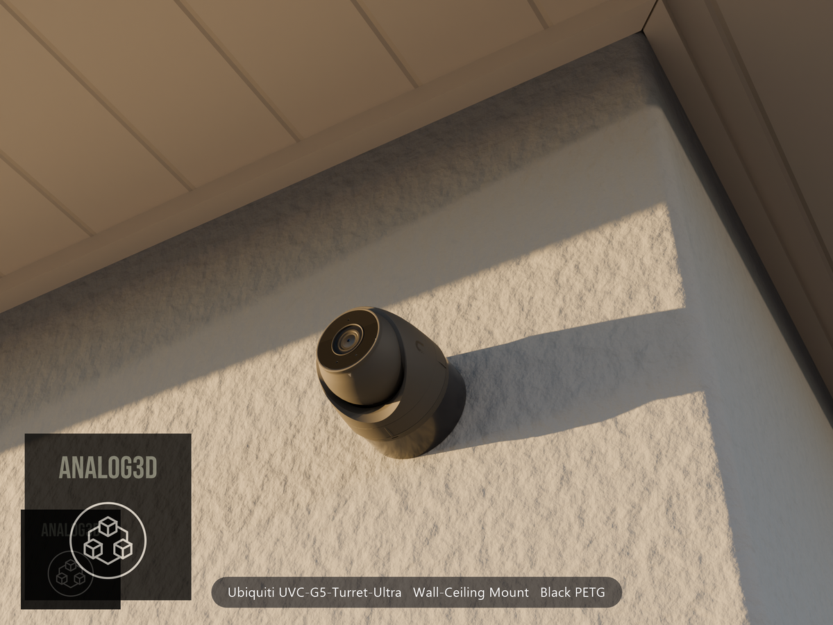 Ubiquiti UVC-G5-Turret-Ultra on black PETG wall-ceiling mount on a stucco wall at golden hour