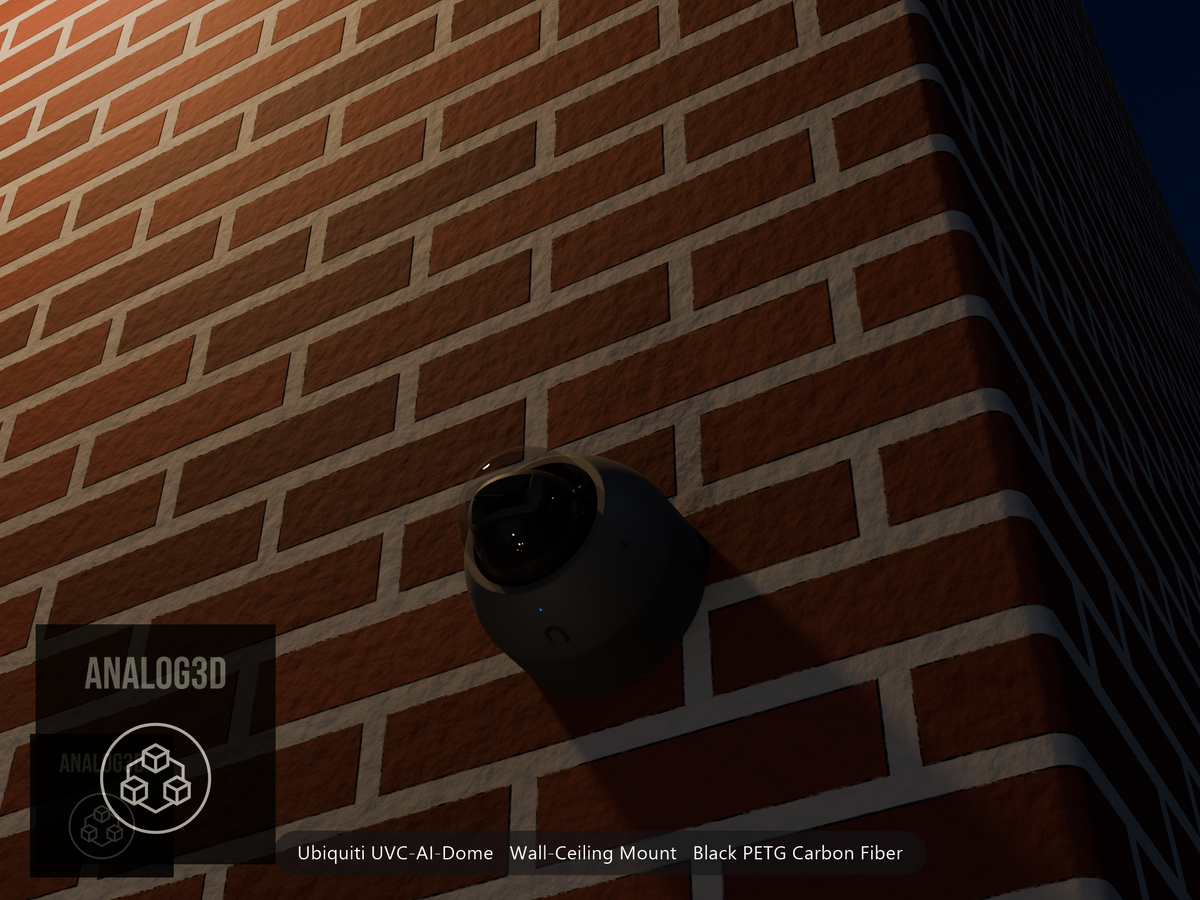 Ubiquiti UVC-AI-Dome on black PETG carbon fiber wall-ceiling mount on a brick wall at night