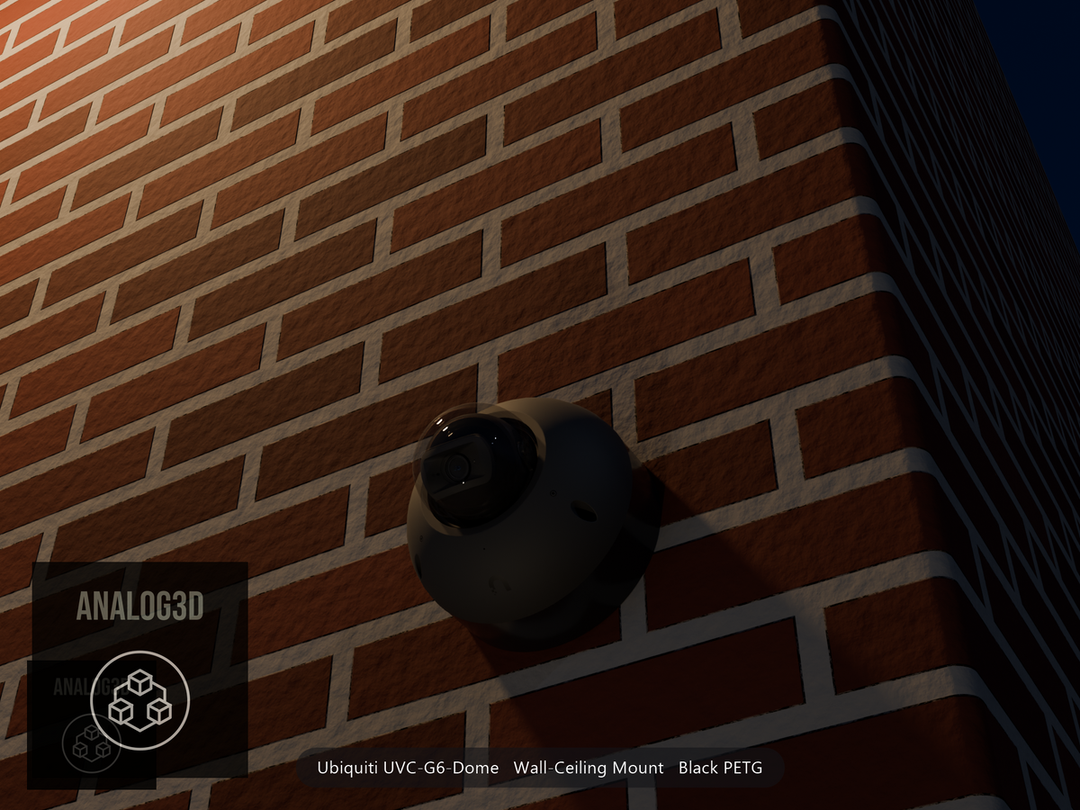 Ubiquiti UVC-G6-Dome on black PETG wall-ceiling mount on a brick wall at night
