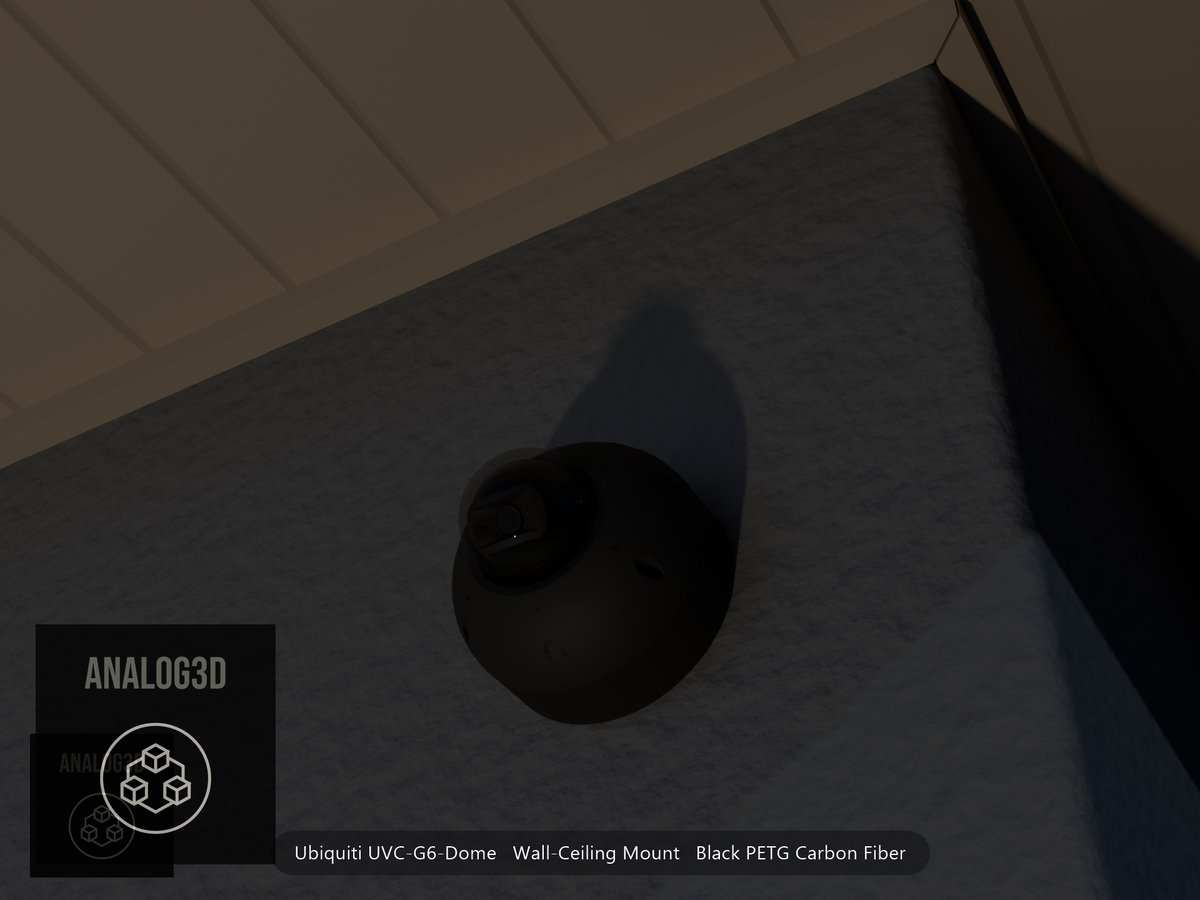 Ubiquiti UVC-G6-Dome on black PETG carbon fiber wall-ceiling mount on a stucco wall at night