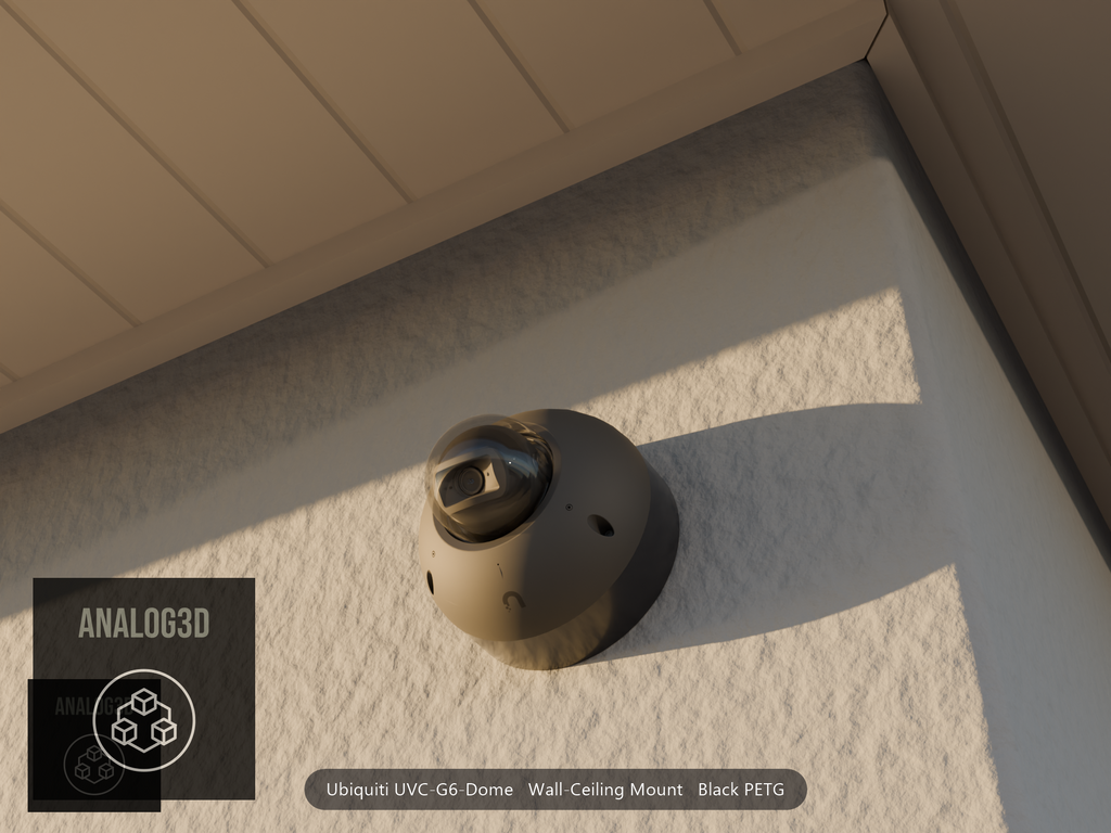 Ubiquiti UVC-G6-Dome on black PETG wall-ceiling mount on a stucco wall at golden hour