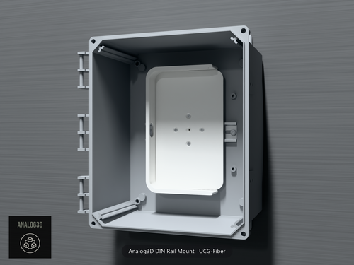 Analog3D DIN rail mount for the UCG-Fiber clipped to a DIN rail inside a PVC enclosure, router removed - White Polycarbonate