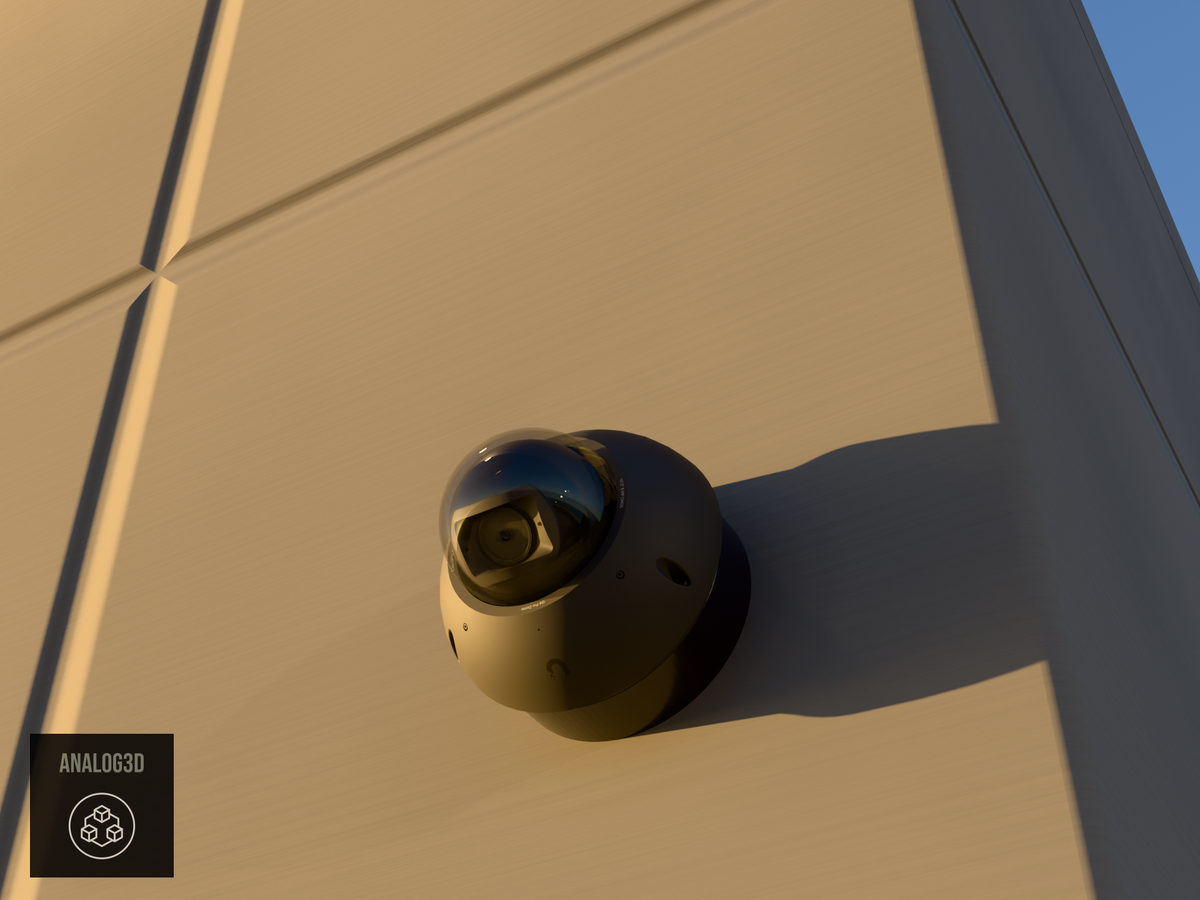 Ubiquiti UVC-G6-Pro-Dome black edition on black PETG heavy duty wall-ceiling mount on a concrete wall at golden hour