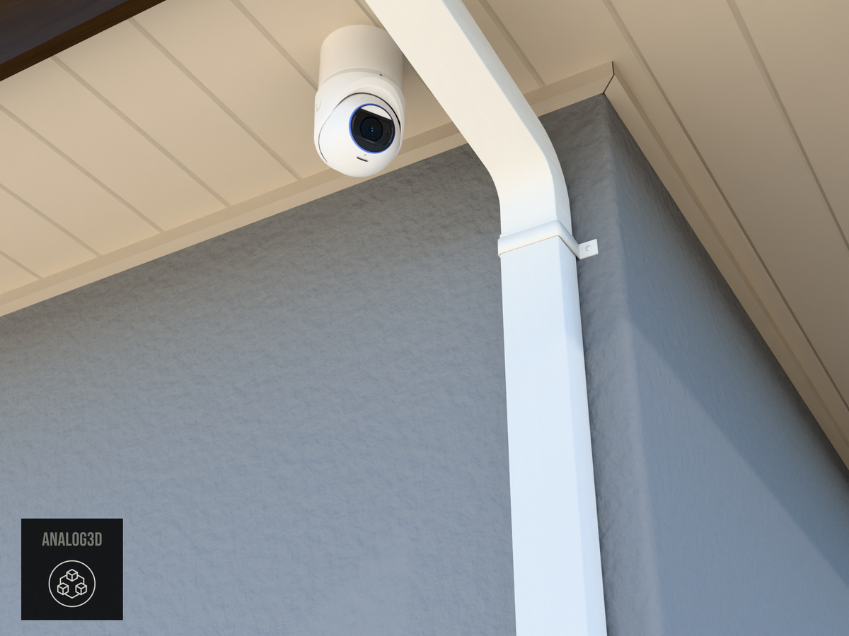 UVC-G6-Pro-Turret heavy duty wall-ceiling mount (3in ext3) hung from the soffit beside a swan-neck downspout