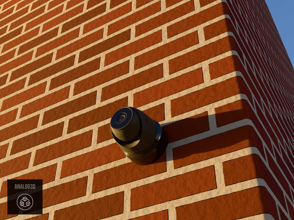 Ubiquiti UVC-G5-Turret-Ultra on black PETG wall-ceiling mount on a brick wall at golden hour