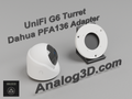 White PETG Dahua PFA136 adapter plate for the Ubiquiti UVC-G6-Turret on a display stand with the camera