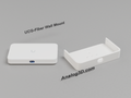 Ubiquiti UCG-Fiber next to its 3D printed wall mount cradle - White Polycarbonate