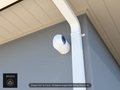 UVC-AI-Turret 30 degree angled wall-ceiling mount (3in ext3) clearing a swan-neck downspout on stucco