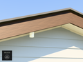 Ring Spotlight and Outdoor Cam angled soffit mount installed under a roof eave, White PETG, 4 inch extension at 4/12 pitch