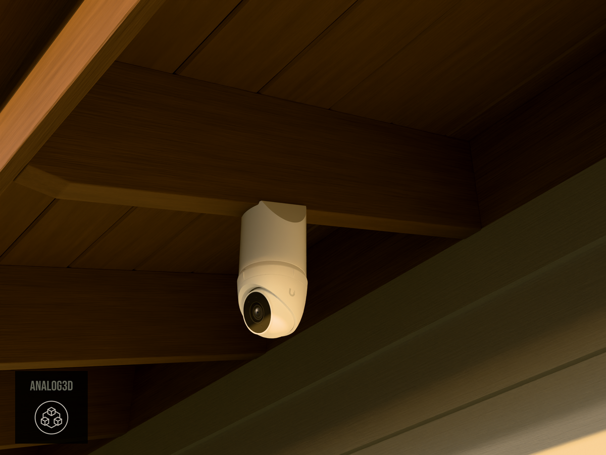 Ubiquiti UVC-G5-Turret-Ultra on white PETG angled rafter tail mount installed on an exposed rafter tail at golden hour, 4in extension at 4/12 pitch