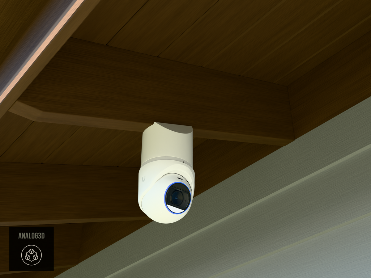 Ubiquiti UVC-G6-Edge-Turret on white PETG angled rafter tail mount installed on an exposed rafter tail in daylight, 4in extension at 4/12 pitch