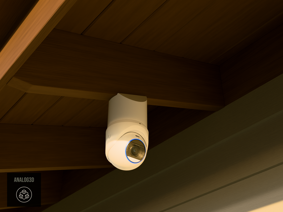Ubiquiti UVC-G6-Edge-Turret on white PETG angled rafter tail mount installed on an exposed rafter tail at golden hour, 4in extension at 4/12 pitch