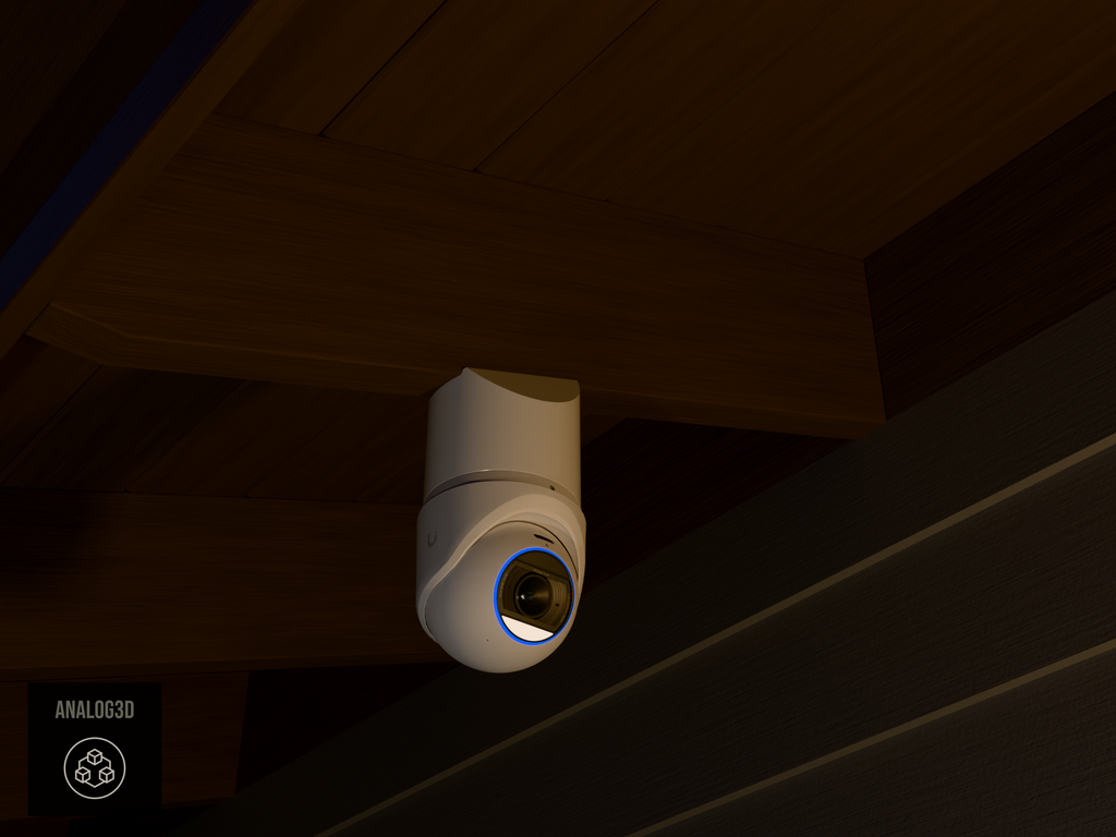 Ubiquiti UVC-G6-Edge-Turret on white PETG angled rafter tail mount installed on an exposed rafter tail at night, 4in extension at 4/12 pitch