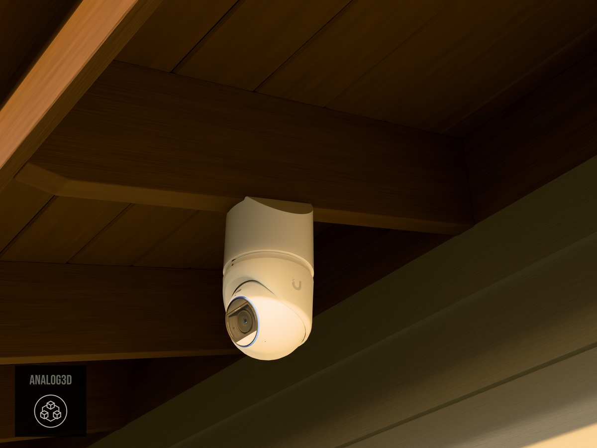 Ubiquiti UVC-G6-Pro-Turret on white PETG angled rafter tail mount installed on an exposed rafter tail at golden hour, 4in extension at 4/12 pitch