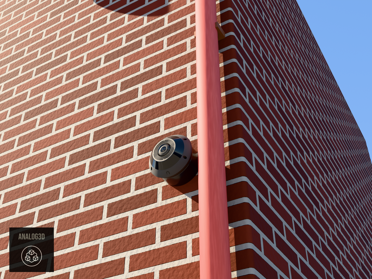 UniFi G6 Pro 360 wall-ceiling mount installed on a brick wall beside a drain pipe, Black PETG, daylight