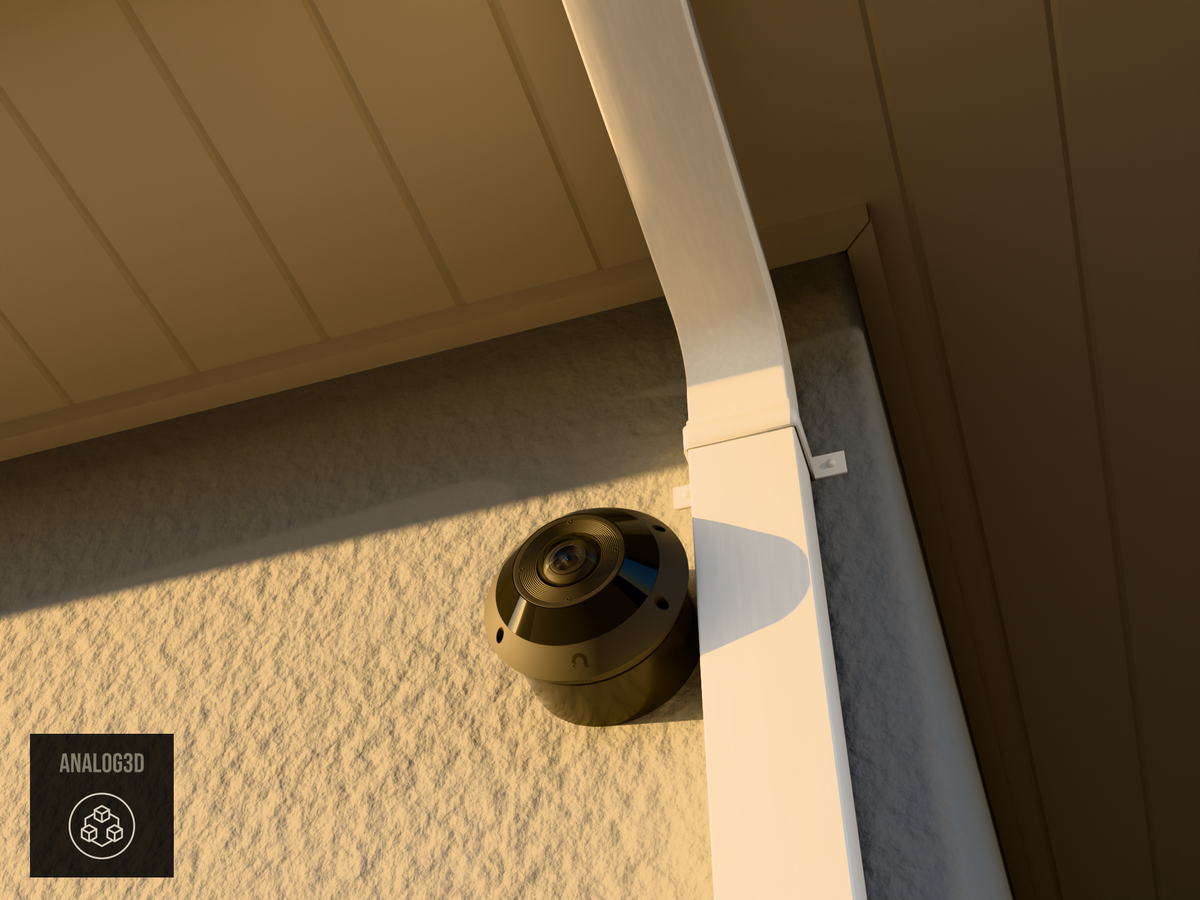UniFi G6 Pro 360 wall-ceiling mount installed on a stucco wall beside a downspout, Black PETG, golden hour