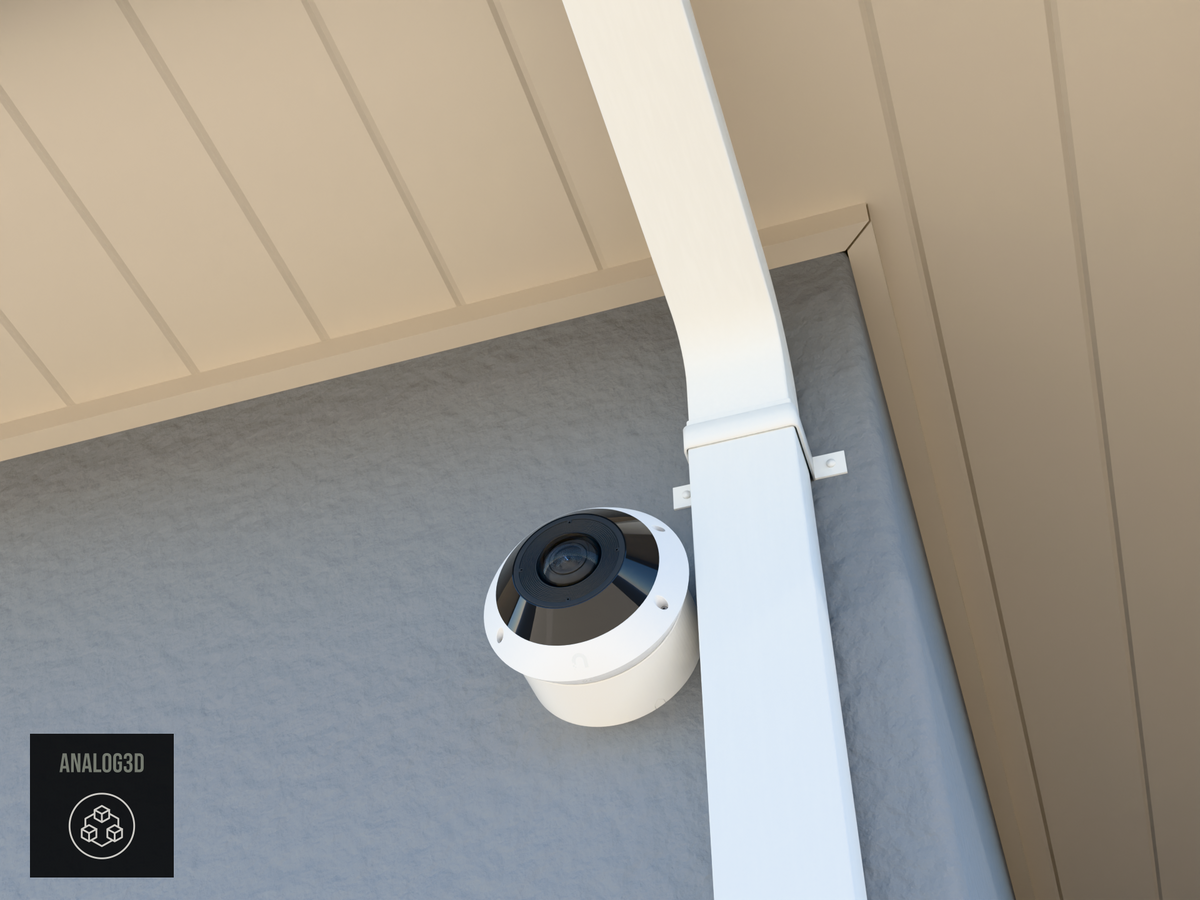 UniFi G6 Pro 360 wall-ceiling mount installed on a stucco wall beside a downspout, White PETG, daylight