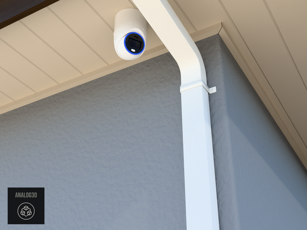 UVC-AI-Turret wall-ceiling mount (3in ext3) hung from the soffit beside a swan-neck downspout