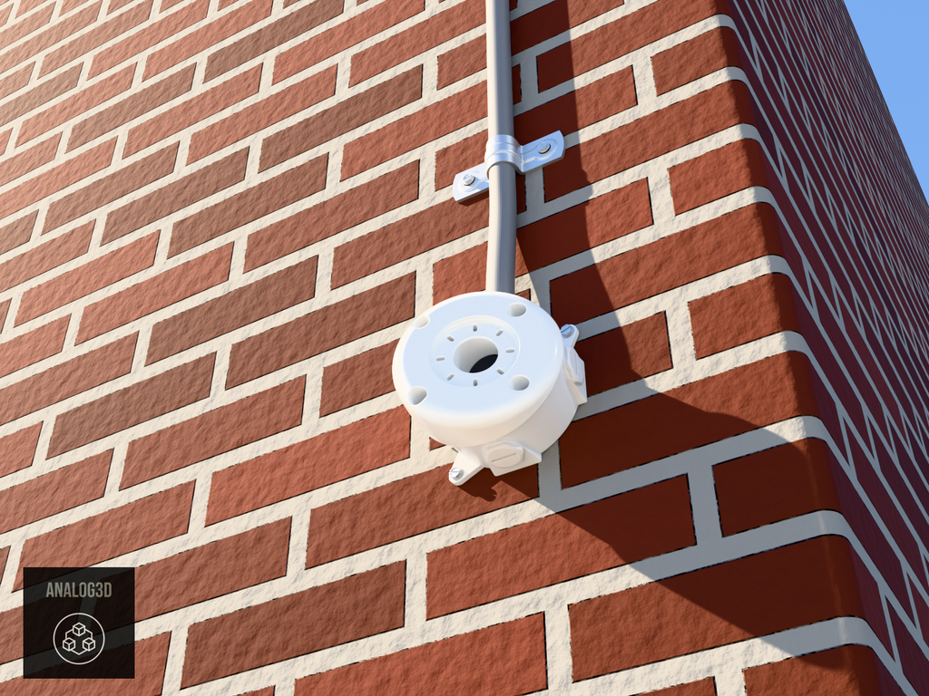 Angled 4 inch round box adapter, 22 degree, bullet camera mount on a brick wall