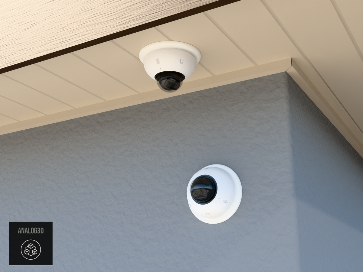 UVC-G6-Dome double-gang round adapter plate installed on a stucco wall and soffit
